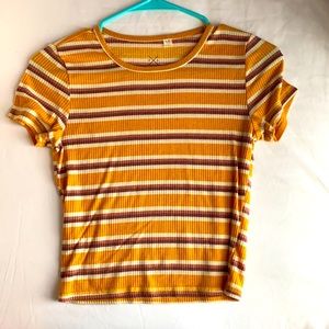 Cropped yellow and maroon striped shirt.